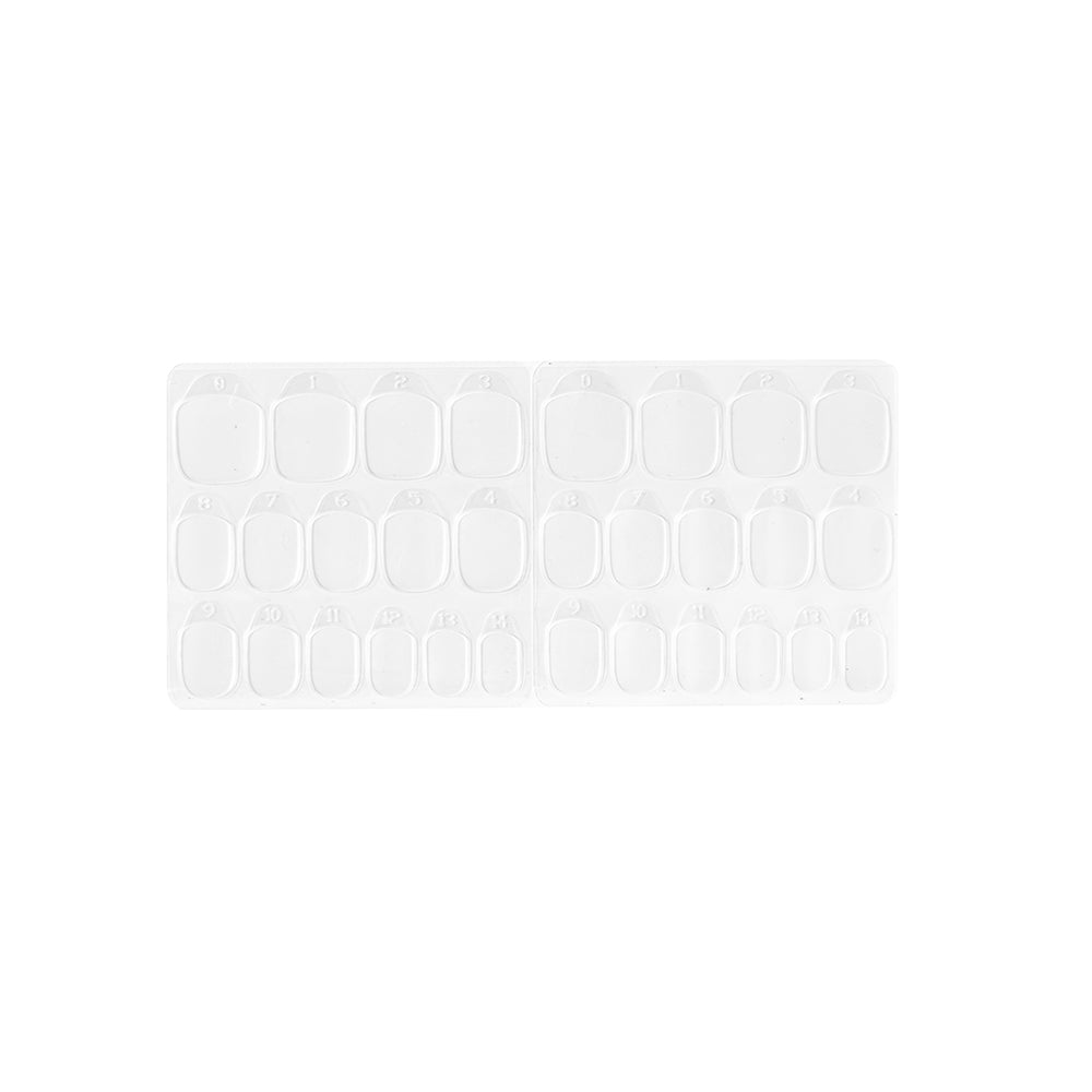 The glamnetic Adhesive Nail Tabs are shown in a clear plastic tray with multiple rows of empty oval and rectangular compartments, ideal for organizing your nail tabs or artificial nails at home. Displayed on a white background.