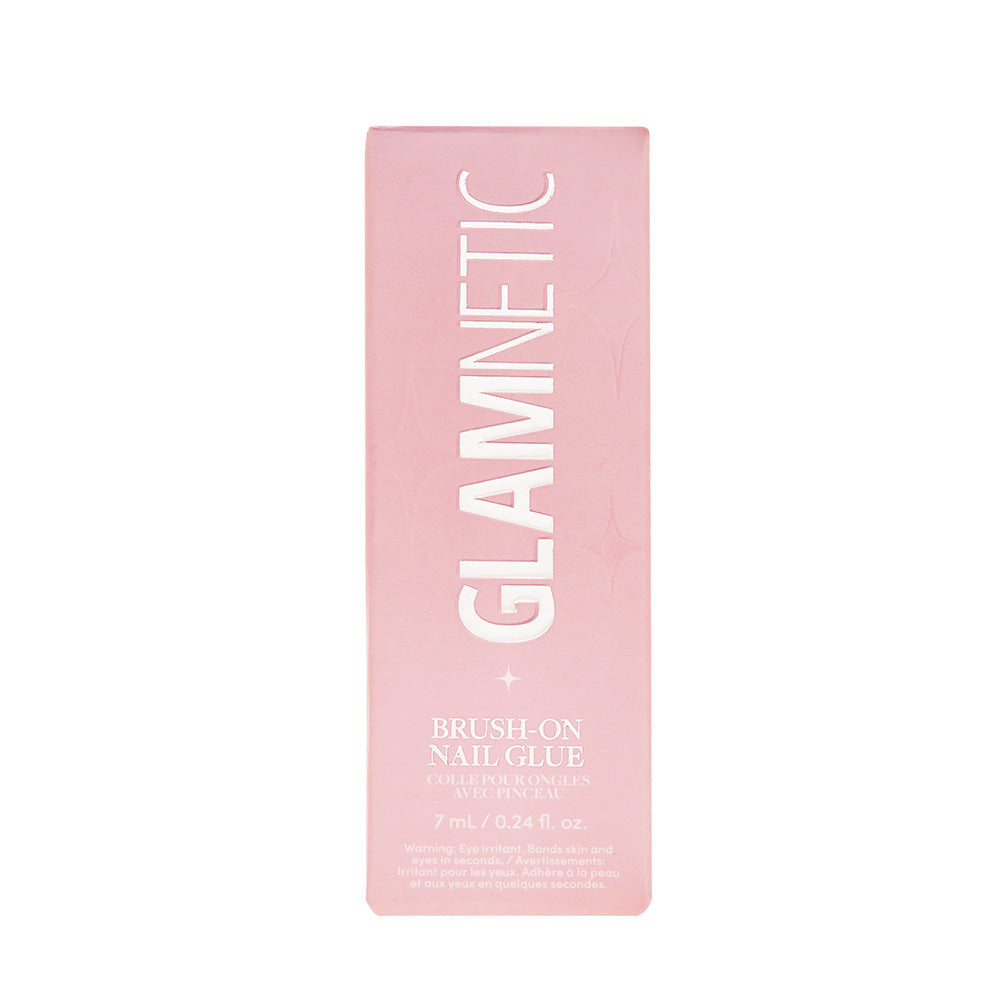 A pink rectangular box labeled glamnetic Brush-On Nail Glue (7 mL/0.24 fl. oz.) stands upright against a white background—ideal for securing your glamnetic Press-On Nails for salon-style nails at home.