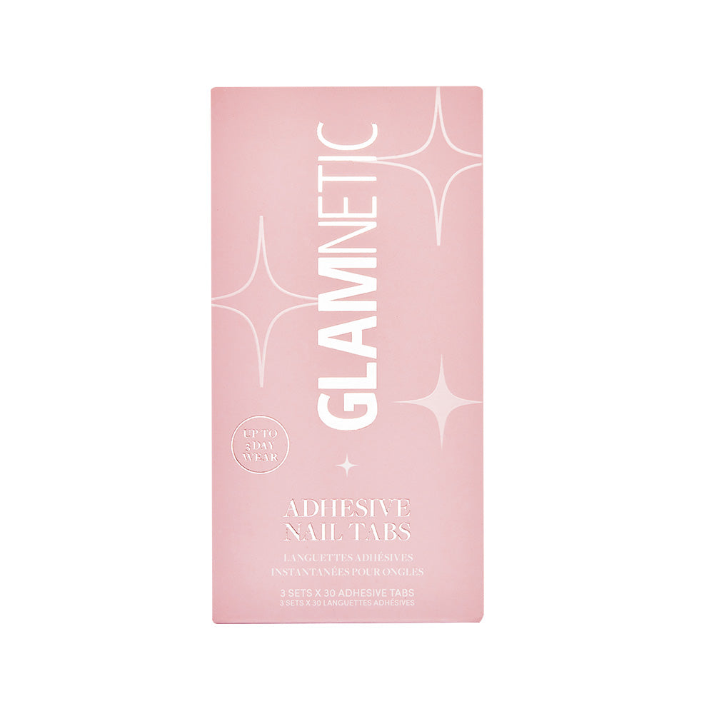A rectangular pink glamnetic box labeled Adhesive Nail Tabs with sparkles and “Up to 5 Day Wear”—perfect for a vegan, cruelty-free at-home manicure.