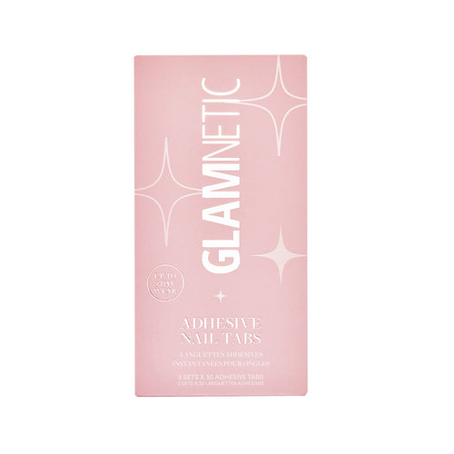 A rectangular pink glamnetic box labeled Adhesive Nail Tabs with sparkles and “Up to 5 Day Wear”—perfect for a vegan, cruelty-free at-home manicure.