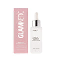 A 30 ml (1.0 fl oz) bottle of glamnetic Press-On Nail Remover with a white dropper cap is shown beside its pink and white box. The vegan, cruelty-free remover is acetone-free.