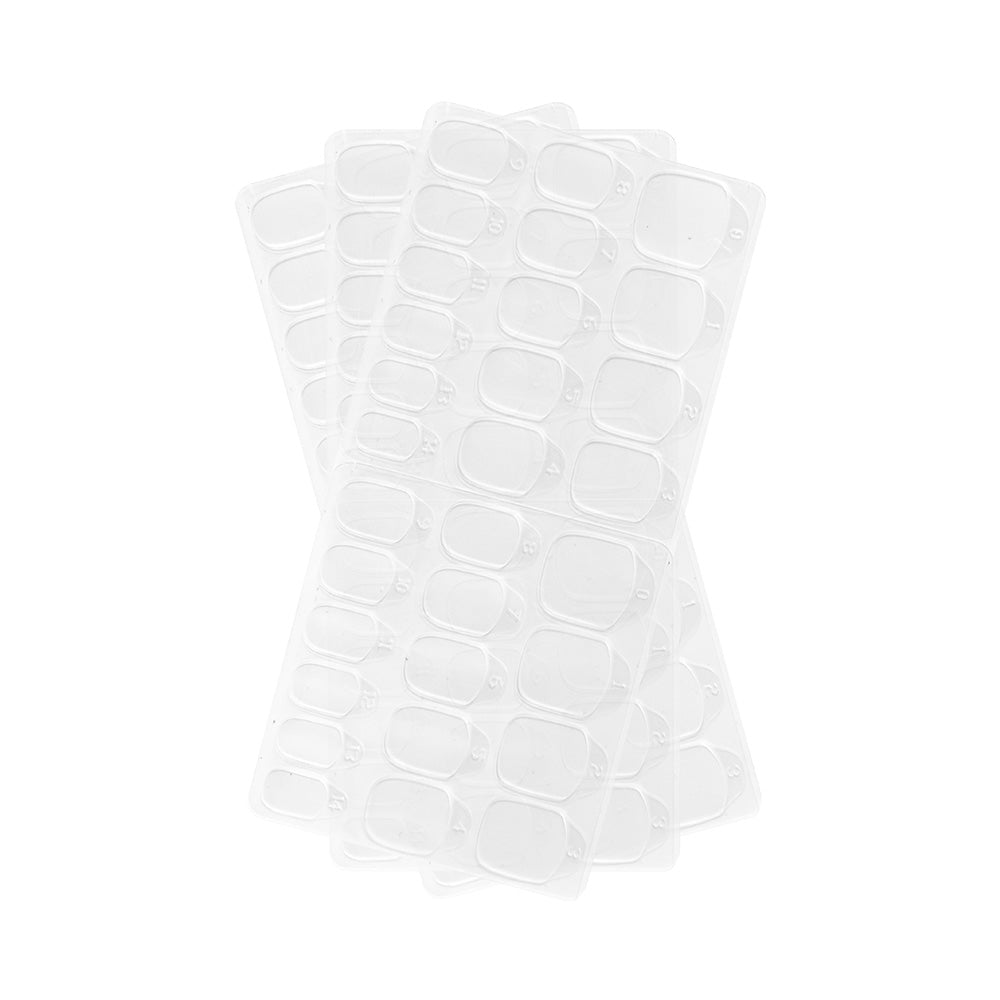 Four clear plastic ice cube trays, each with rectangular compartments, are stacked on a white background—perfect for organizing small items like glamnetic Harry Potter™ Adhesive Nail Tabs.