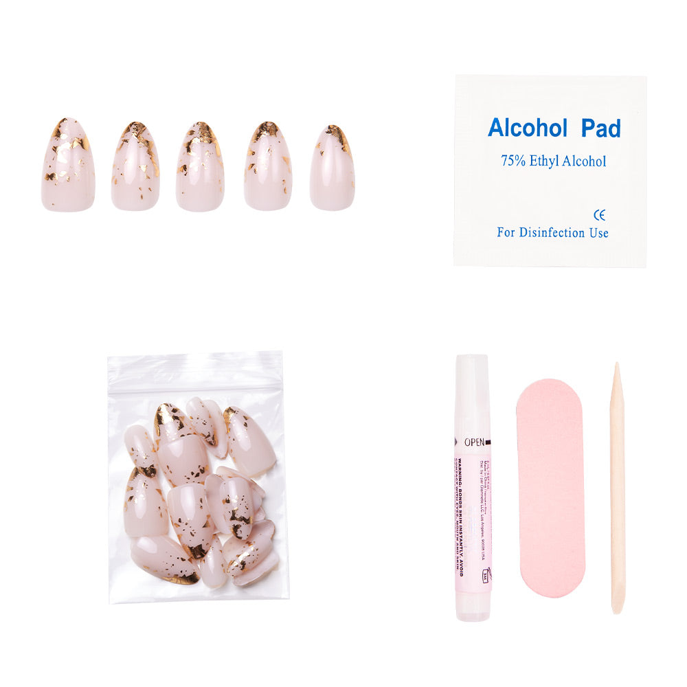 The glamnetic 24K set includes five short almond nails with gold foil accents, extra nails, nail glue, an alcohol pad, a pink nail file, and a wooden cuticle stick—all displayed on a white background.