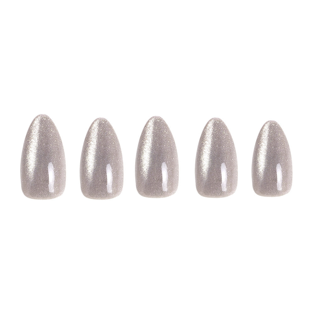 Five glossy, silver cat’s-eye artificial nails in a short almond shape from glamnetic’s Oslo set are arranged in a row on a white background, highlighting the chic design.