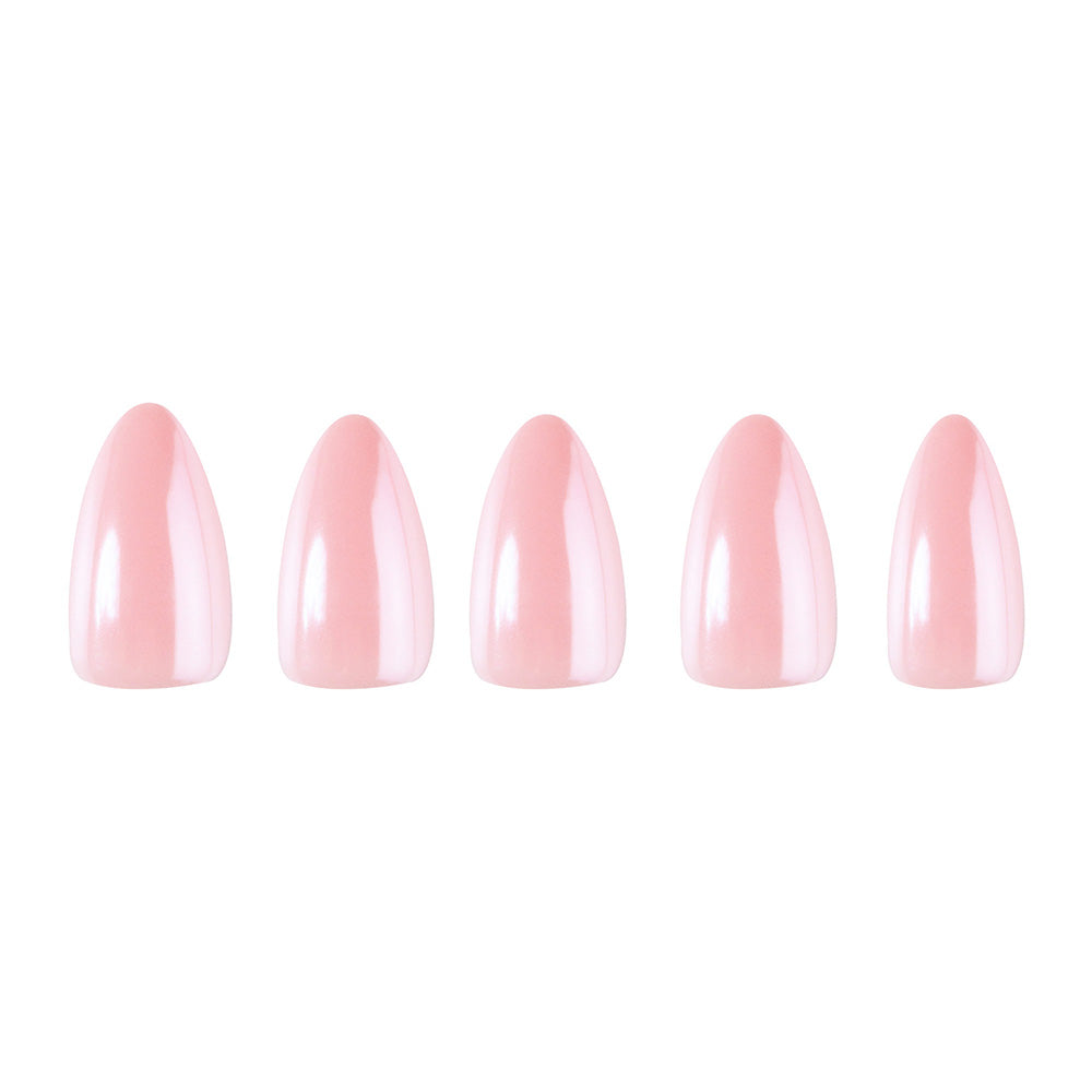 Five blush pink, short almond-shaped press-on nails from glamnetic’s First Kiss set are arranged in a row on a white background, highlighting the set’s glossy finish.