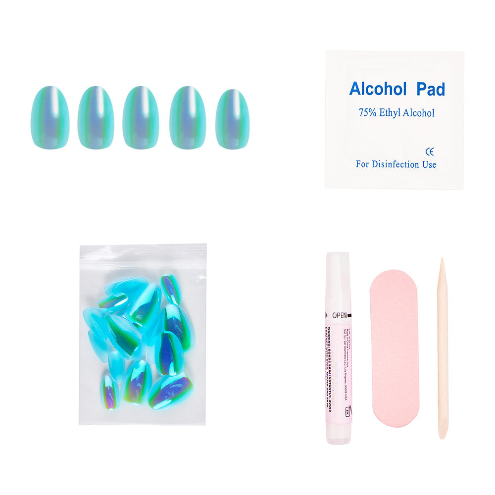 The glamnetic Siren Nail Set includes iridescent blue-green press-on nails with a holographic finish, an alcohol pad, extra nails, nail glue, a pink file, and a wood cuticle stick—all displayed on a white background.