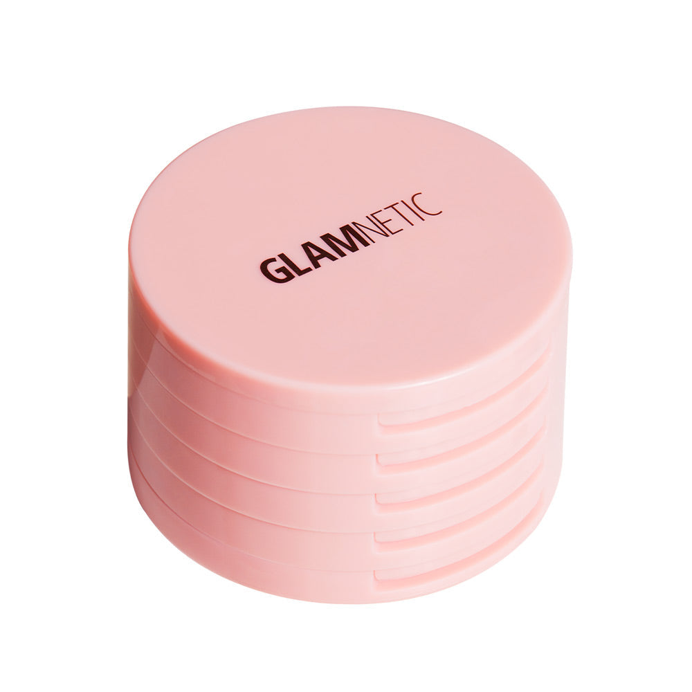The Glam & Go Travel Case by glamnetic is a round, light pink container with glamnetic boldly printed on the lid. Its smooth sides have horizontal grooves—ideal for carrying your lash extensions or magnetic lashes on the go.