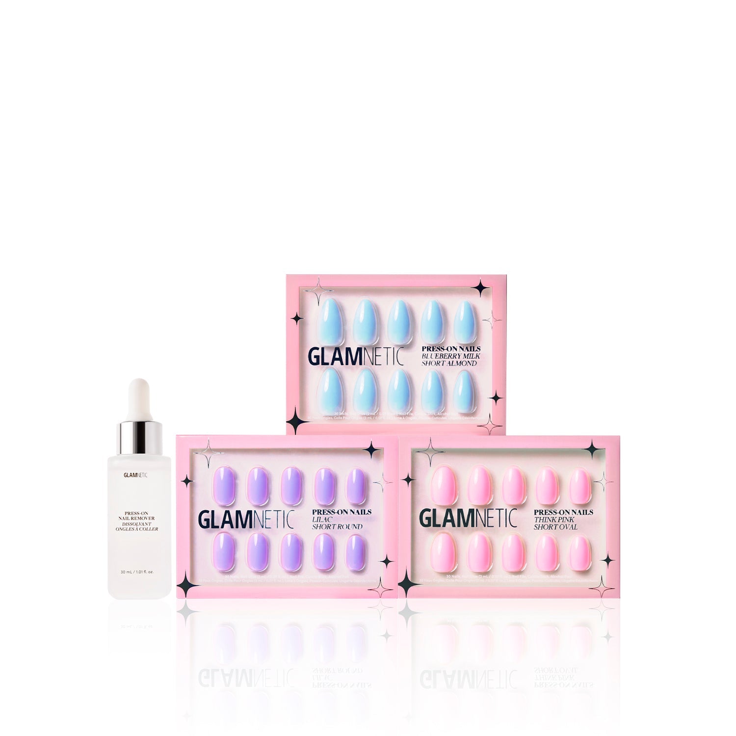 Three boxes of glamnetic Blooming Buds press-on nails are stacked beside a white dropper bottle labeled glamnetic Cuticle Oil, all set against a white background.