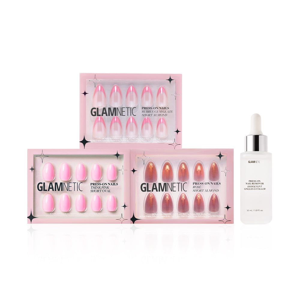 Three boxes of glamnetic Blush Crush press-on nails in pink shades, including Bubble Gum Glaze, are shown beside a bottle of glamnetic nail glue with a dropper cap on a white background.