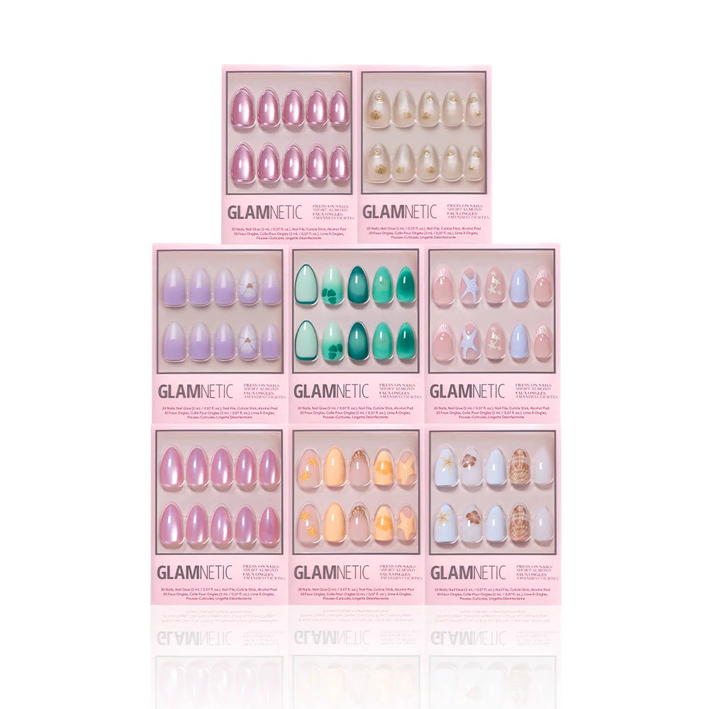 Nine boxes of glamnetic’s Almonds At Sea press-on nails are arranged in a grid, each featuring short almond shapes with ocean-inspired designs, pink packaging, and playful 3D starfish accents.