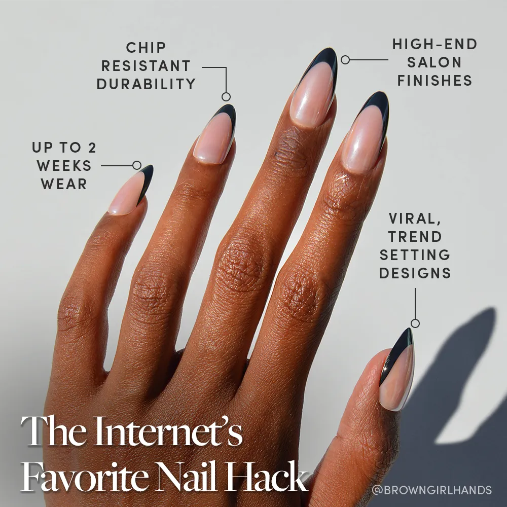 A hand with long, almond-shaped nails features a minimalist black tip design inspired by glamnetic Black Truffle Press-On Nails—chip-resistant, high-end finish, trendy viral style, and up to 2 weeks of durable wear.