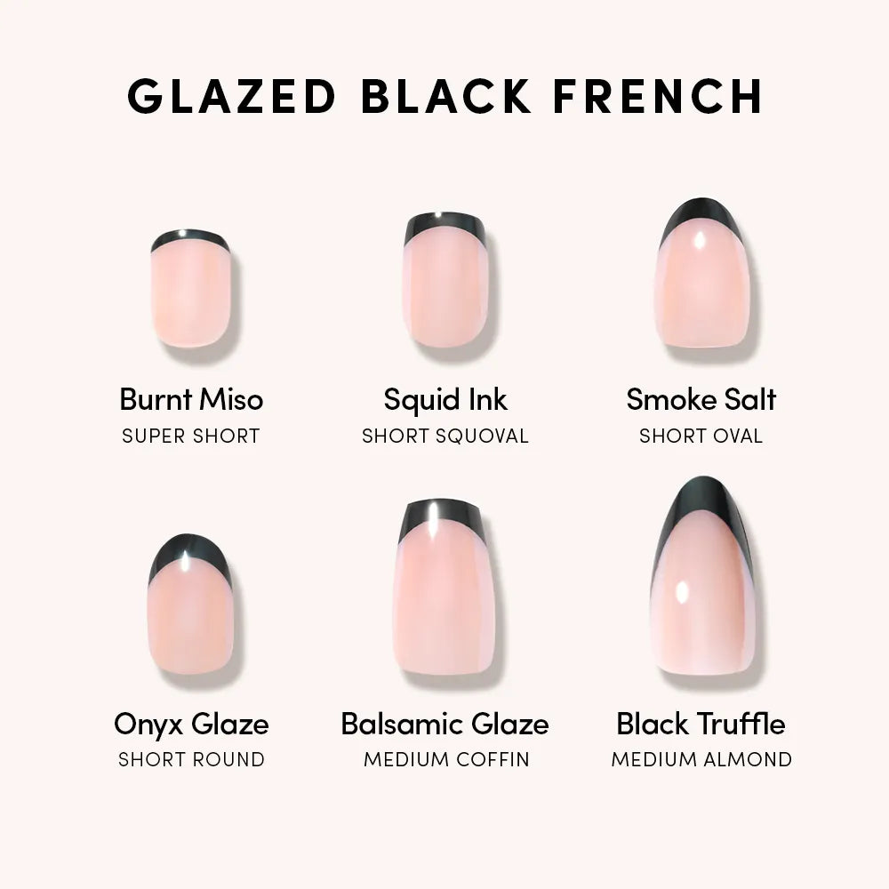 Six glossy glazed black French tip nails by glamnetic—Burnt Miso (super short), Squid Ink (short squoval), Smoke Salt (short oval), Onyx Glaze, Balsamic Glaze, and Black Truffle—each with a unique shape and finish.