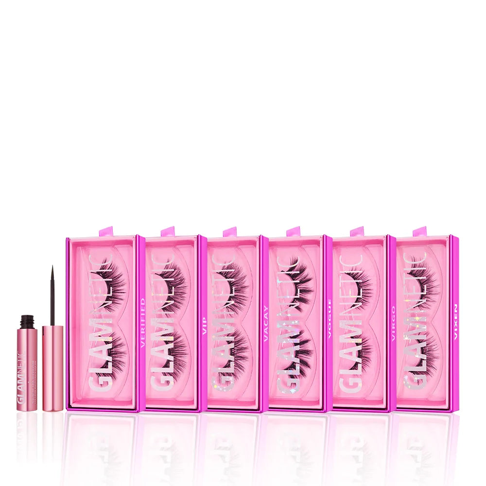 Six pink glamnetic Ultimate Lash Wardrobe boxes are lined up side by side, each showing a reusable pair of magnetic lashes, with an open pink tube of liquid eyeliner in front.