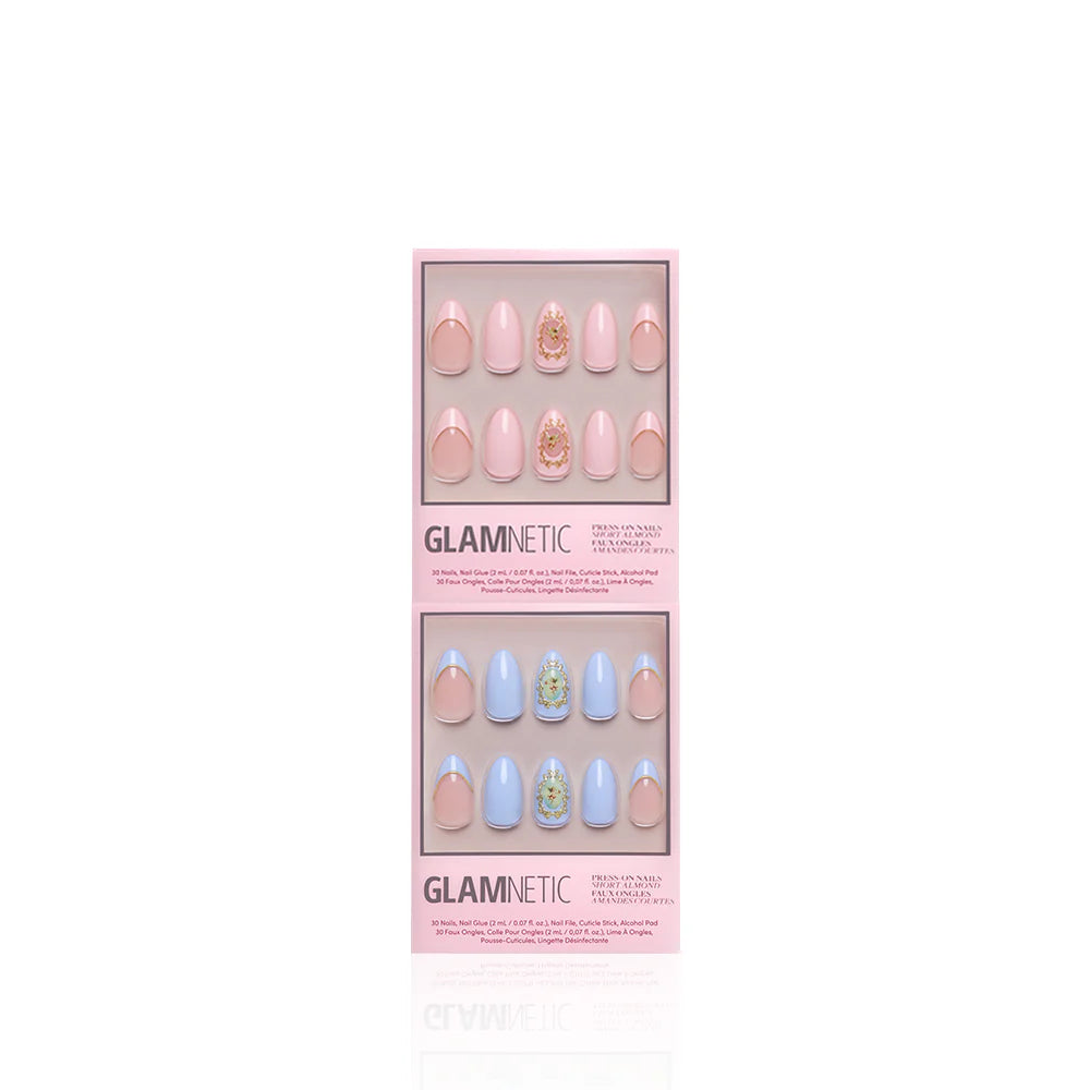 Two boxes of glamnetic's Heaven Sent press-on nails, featuring almond pastel pink and blue sets with 3D gold details and gem accents, are displayed against a white background.