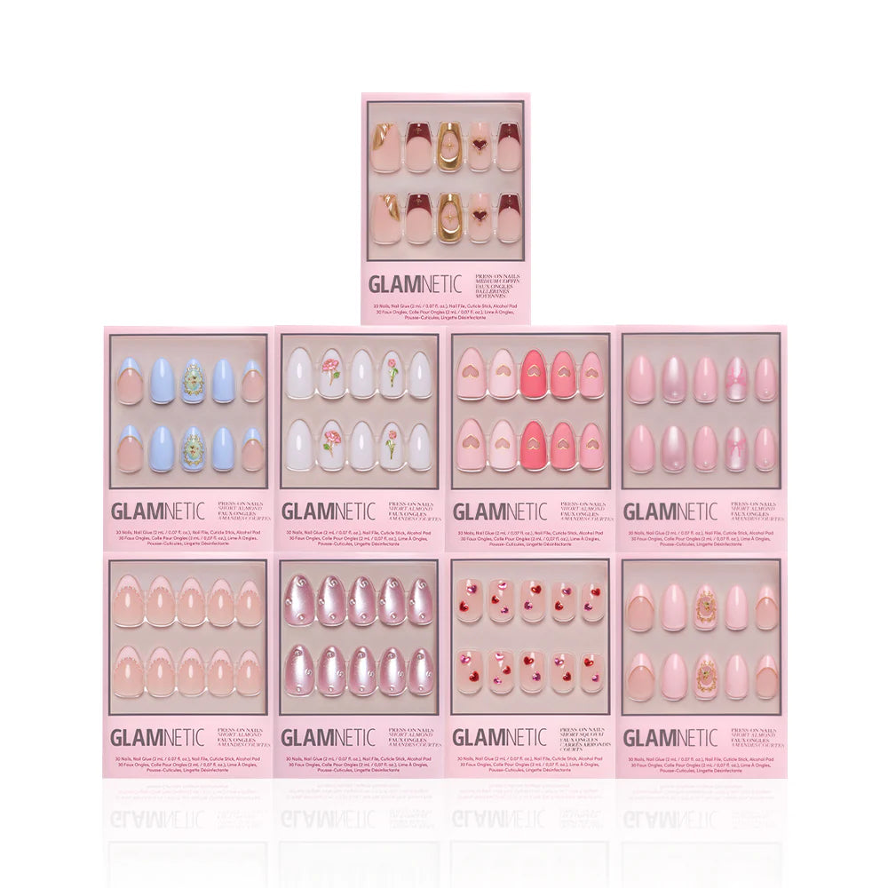 Ten boxes of glamnetic Love in 3D press-on nails, featuring assorted pink and pastel designs with 3D art and almond styles, are stacked pyramid-style on a white background. Each pink box highlights different unique nail art options.