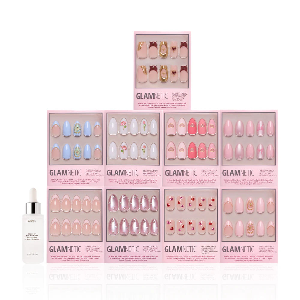 Ten boxes of glamnetic Love in 3D press-on nails, featuring pink and pastel almond-shaped sets with 3D pearl art, are stacked in a pyramid. A bottle of nail glue or serum is placed in front on the left side.
