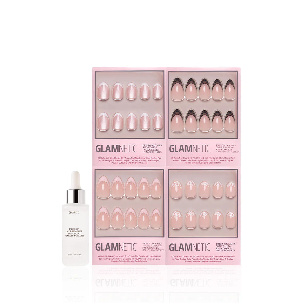 Four sets of glamnetic The French Kiss press-on nails in pink packaging, featuring modern nude and pink almond designs, are displayed beside a white bottle labeled glamnetic Press-On Nail Remover.