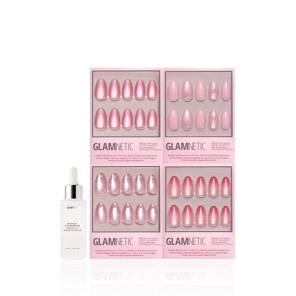 Four sets of Velvet Valentine blush nail designs by glamnetic, in glossy and glitter finishes, are displayed in pink packaging beside a white adhesive dropper bottle. The short almond set pops against the clean white background.