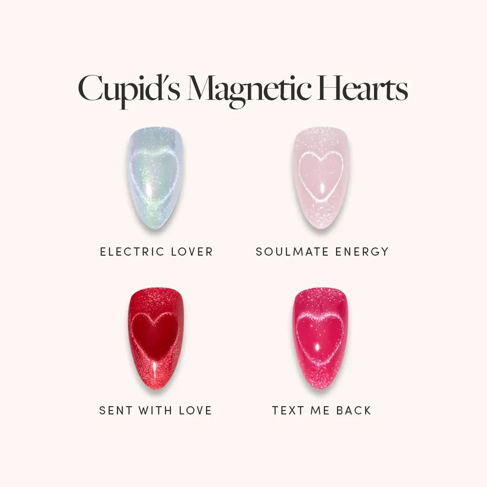 Cupid’s Magnetic Hearts by glamnetic features four almond nails: pale blue shimmer Electric Lover, pale pink with a white heart for sweet heart designs, dark red shimmer Sent With Love, and bright pink Text Me Back.