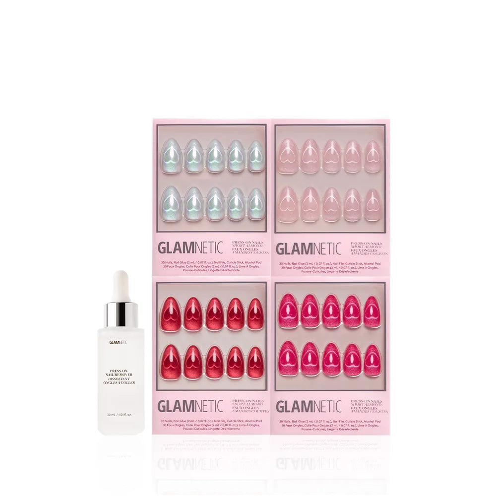 Glamnetic's Cupid's Magnetic Hearts almond nail sets in blue, light pink, pink, and red are shown in boxes next to a white dropper bottle of nail remover, all displayed against a white background.