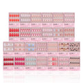 The glamnetic Love Notes Collection features 20 press-on nail kits in pink packaging, with almond and coffin shapes in pink, nude, red shades, plus playful patterns or faces, all neatly arranged in rows.