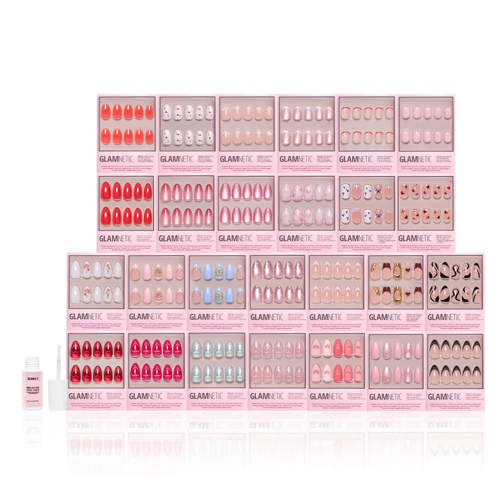Several glamnetic Love Notes Collection press-on nail sets in almond and coffin styles are displayed in pink packaging, with a bottle of nail glue to the left on a white background.