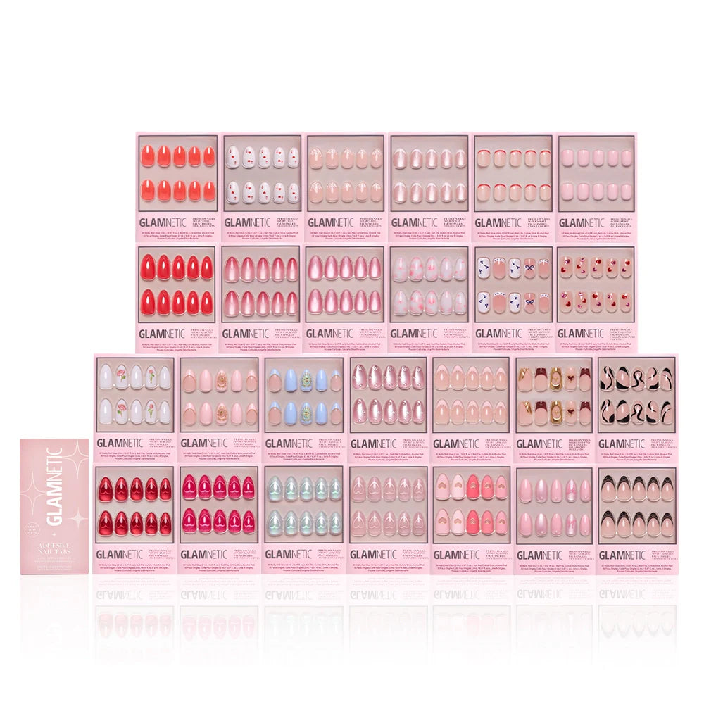 Thirty boxes of glamnetic press-on nails, including the Love Notes Collection and chic coffin styles, are arranged on a white background in red, pink, nude, blue, and patterned designs.