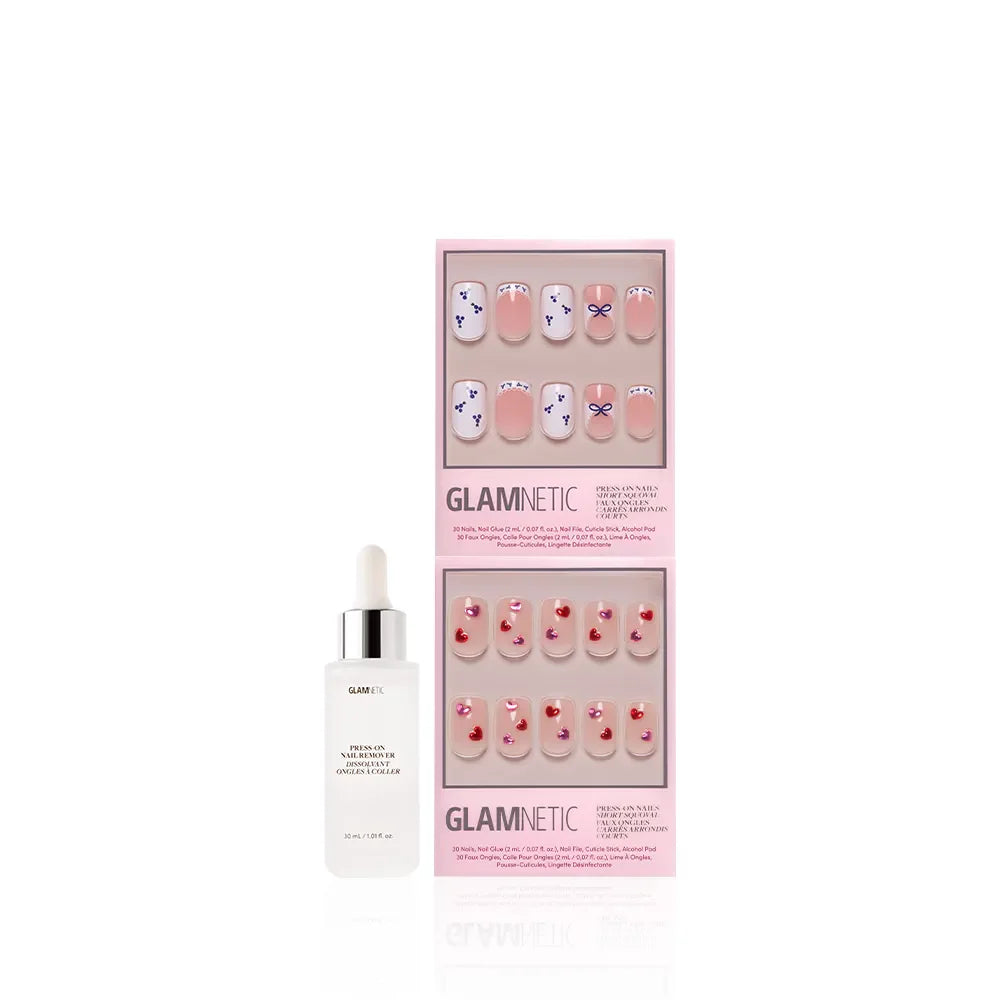 A bottle of Glamnetic cuticle oil with dropper sits beside The Sweet Squovals by glamnetic—press-on nails in pink packaging, featuring blue and red flower designs or red hearts on nude, perfect for everyday glam.
