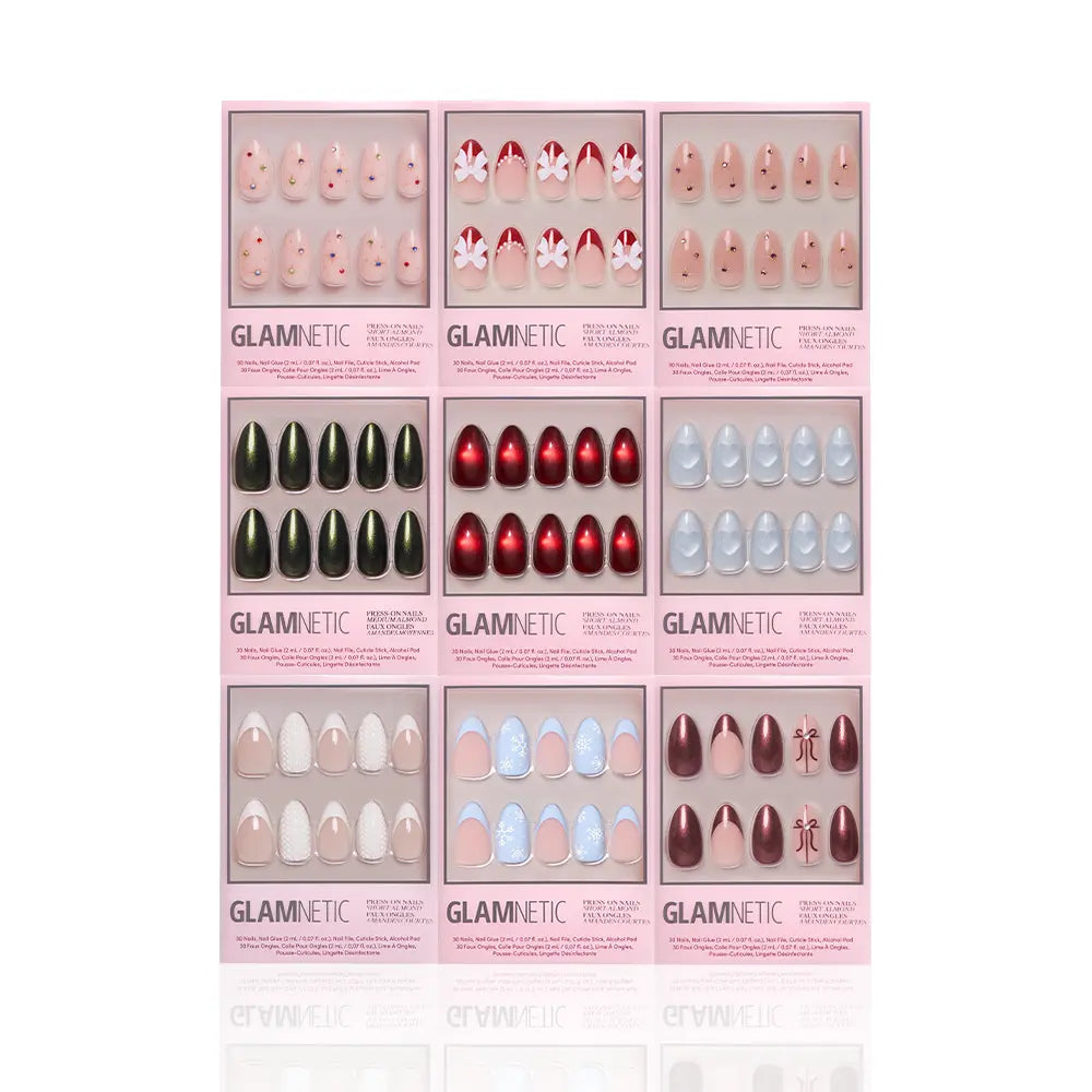 Nine sets of glamnetic Almond Joys press-on nails are arranged in a 3x3 grid, each box featuring almond-shaped nails in various colors and designs, such as glitter French tips, red, black, blue, nude, floral, and holiday patterns.