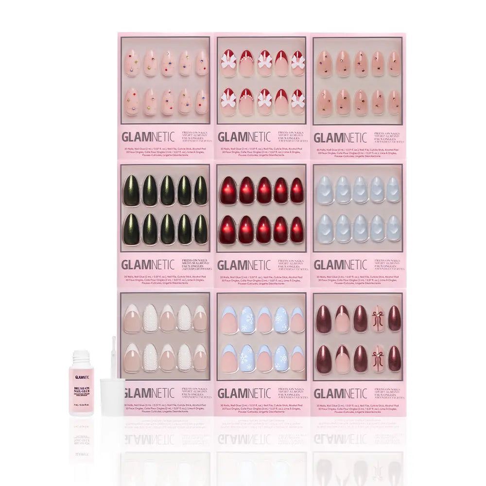 Nine glamnetic Almond Joys press-on nail sets, with almond shapes and glitter French tips in assorted colors, are arranged in a 3x3 grid. A nail glue bottle and applicator are displayed in front, all set against a white background.