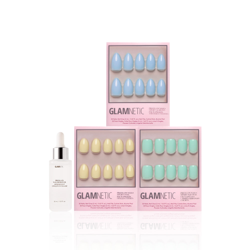 Three boxes of glamnetic Anns Palette press-on nails in pastel blue, yellow, and green with a glossy finish are displayed above a white bottle of glamnetic nail serum with a dropper, all set against a white background.