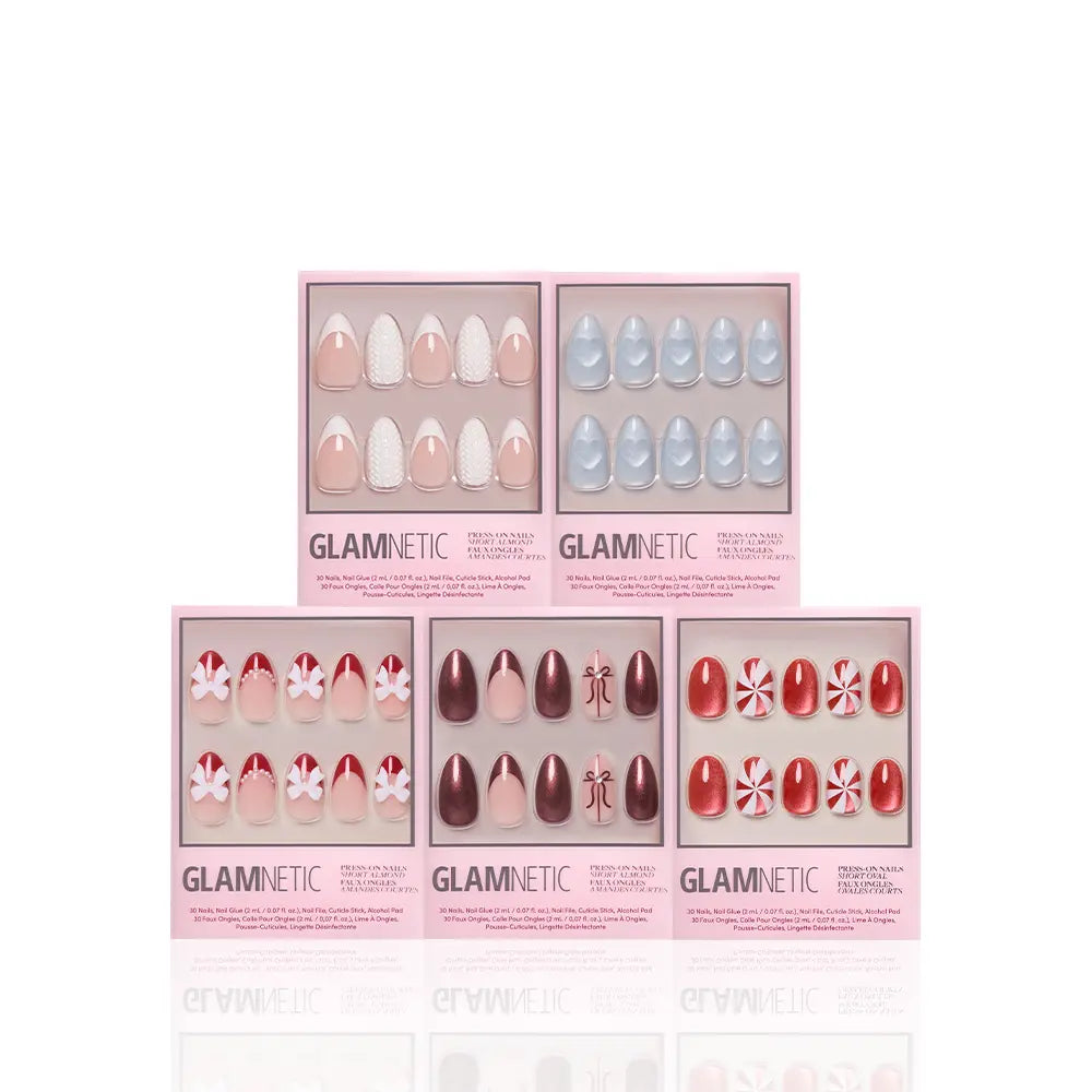 Ann’s Festive Five by glamnetic features five boxes of press-on nails in assorted designs and colors—nude, light blue, maroon, red with candy-inspired patterns—ideal for holiday or party manis, displayed against a white background.