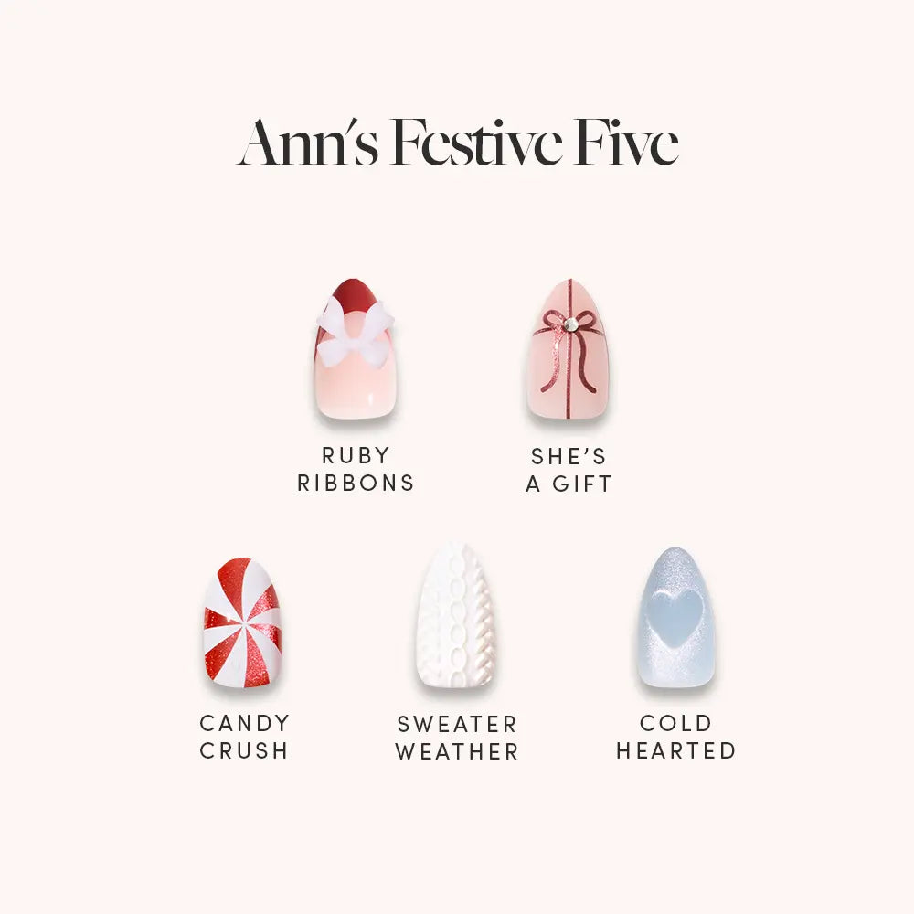 Ann's Festive Five by glamnetic features party-ready manis: Ruby Ribbons (red ribbon on pink), She’s a Gift (red bow on white), Candy Crush (red/white swirl), Sweater Weather (white knit), and Cold Hearted (blue with heart).