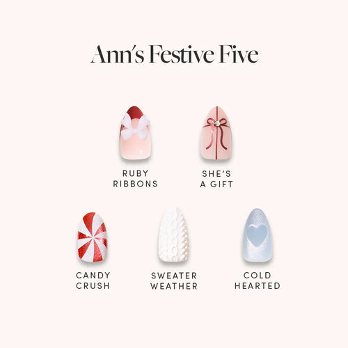 Ann's Festive Five by glamnetic features party-ready manis: Ruby Ribbons (red ribbon on pink), She’s a Gift (red bow on white), Candy Crush (red/white swirl), Sweater Weather (white knit), and Cold Hearted (blue with heart).