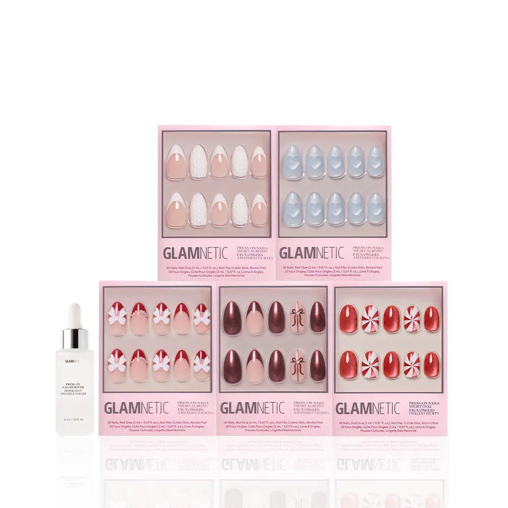 Five boxes of glamnetic Ann's Festive Five press-on nails in assorted designs are displayed in two rows, with a nail glue bottle in front—ideal for party-ready manicures—on a white background.