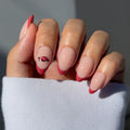 Show off your game day spirit with the glamnetic Arkansas Razorbacks Press-On Nail Set, featuring almond-shaped pink French tips and a detailed rose accent nail. Perfect for fans in a white long-sleeve top!.