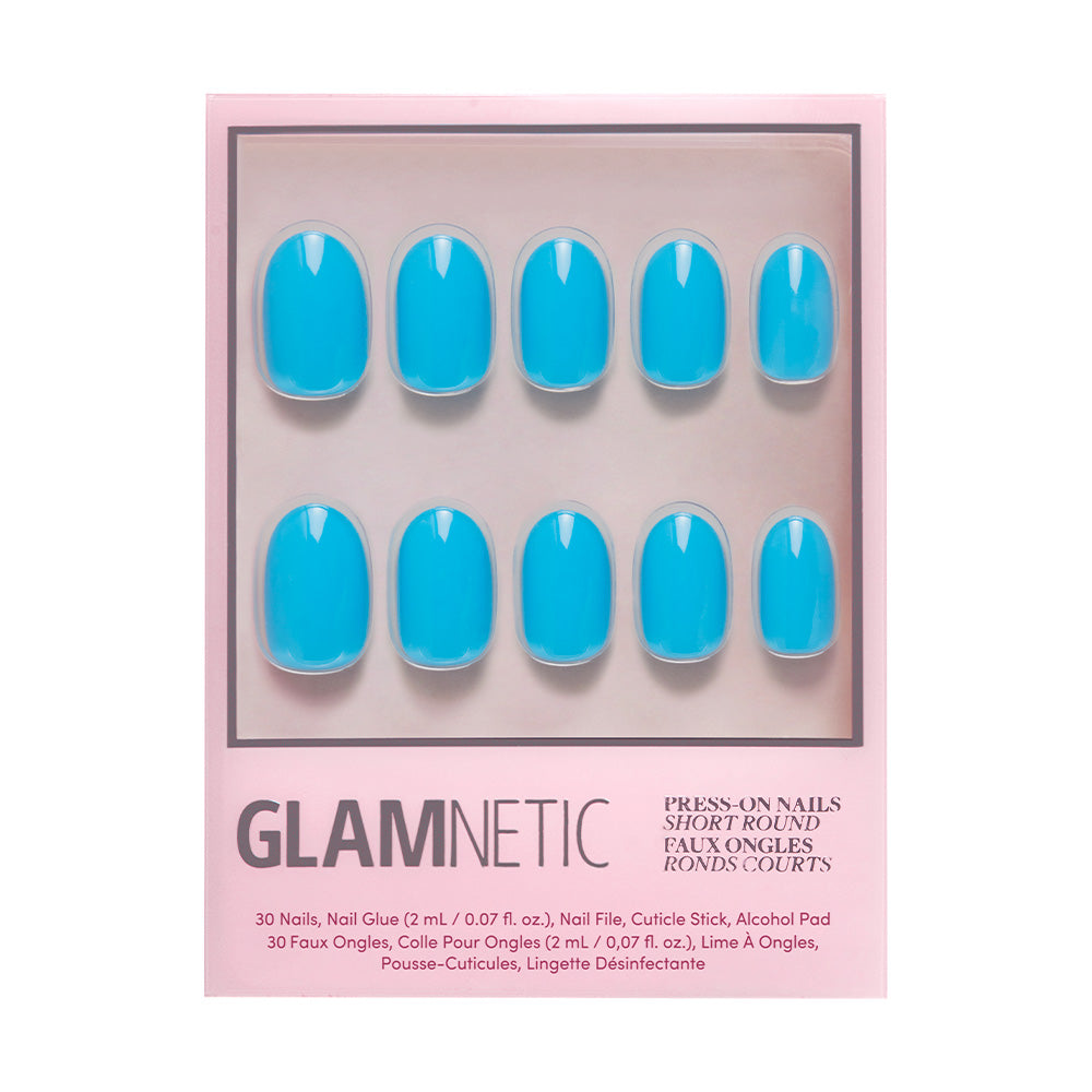 A box of glamnetic Azure Blue nails in a vibrant shade, featuring ten short, round press-ons on a pink backing. The packaging highlights long-lasting wear, perfect for summer fun.