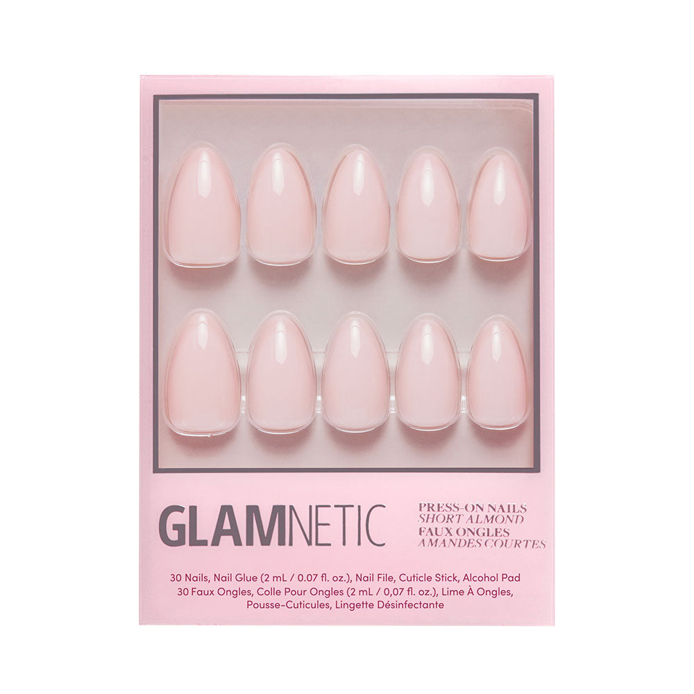 The glamnetic Ballet Pink press-on nail set includes 10 short almond-shaped, glossy nails plus nail glue, a cuticle stick, an alcohol pad, and a disinfectant wipe.