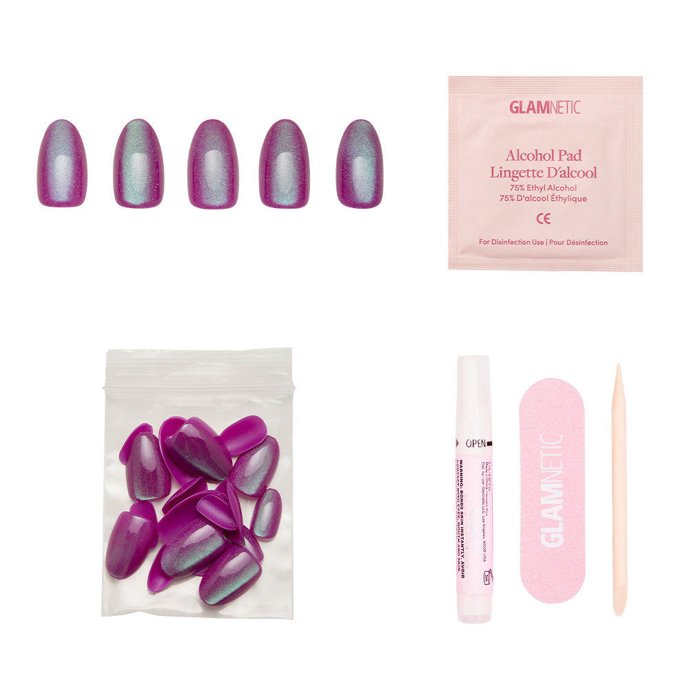 The glamnetic Berry Fizz set includes five purple shimmering velvet metallic nails, extra nails, an alcohol pad, nail glue, a pink nail file, and a wooden cuticle stick, all displayed on a white background.