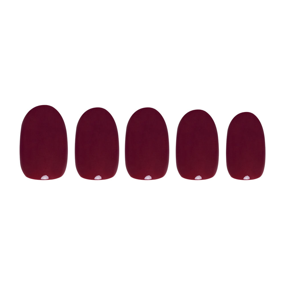Five glossy dark burgundy press-on nails from glamnetic’s Berry Maroon set are arranged in a row on a white background, adding rich Fall Forest vibes to your manicure.