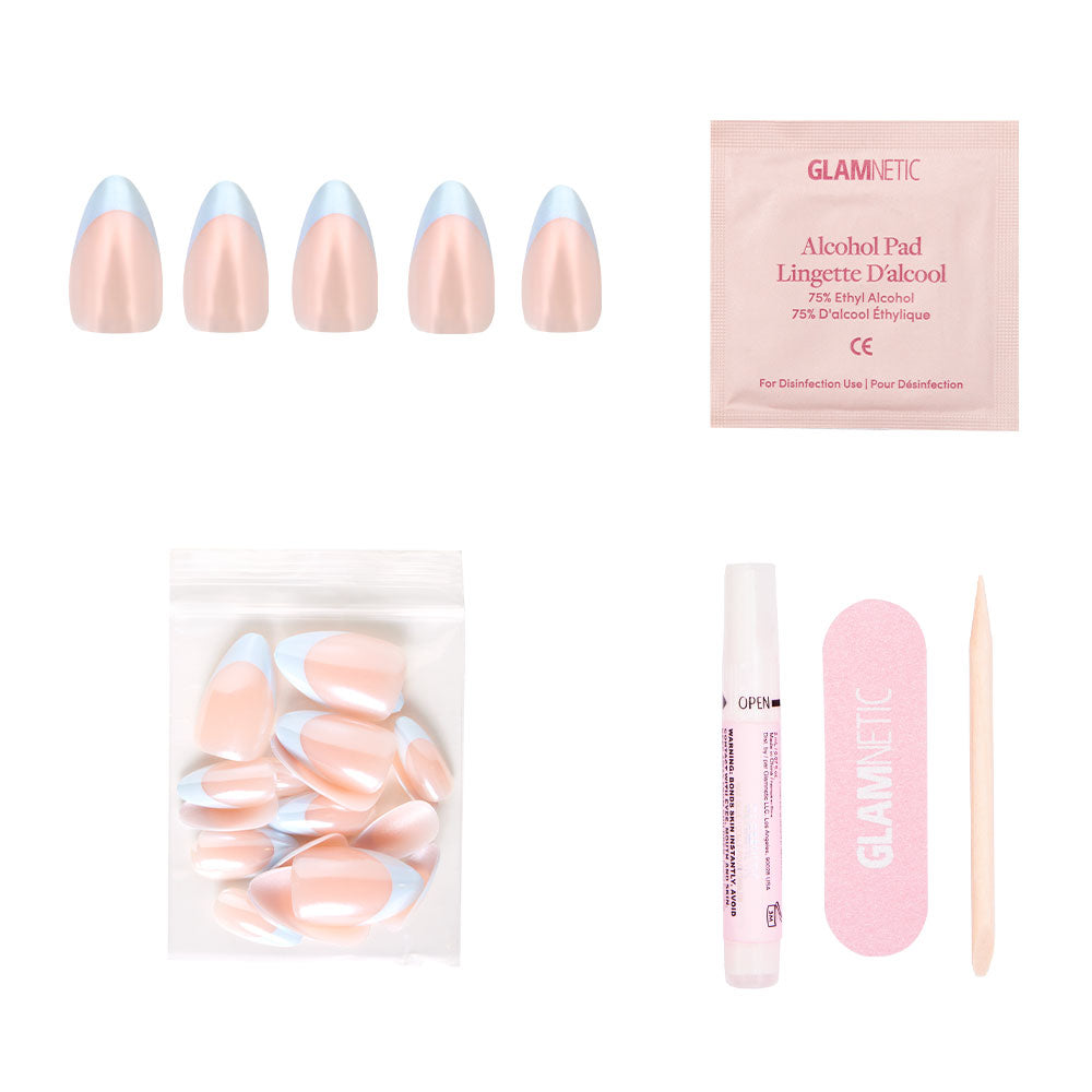 The glamnetic Blueberry Icing Nail Set features five pastel pink and blue nails with a chic glazed finish, plus an alcohol pad, extra nails, nail glue pen, pink file, and cuticle stick—all on a white background.