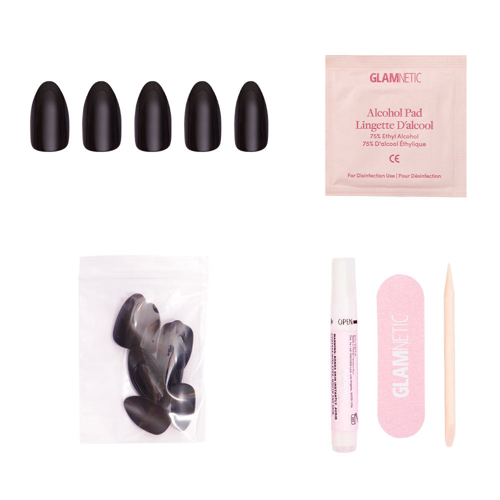 The glamnetic Boba kit includes almond-shaped black press-on nails, an alcohol pad, extra nails, nail glue tube, pink nail file, and wooden cuticle stick, all displayed on a white background.