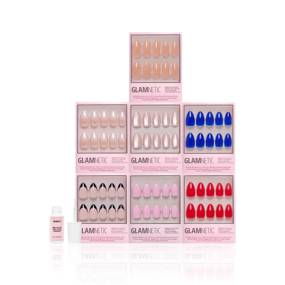 Glamnetic nail product set with various colored magnetic nails and brush-on nail glue on a white background