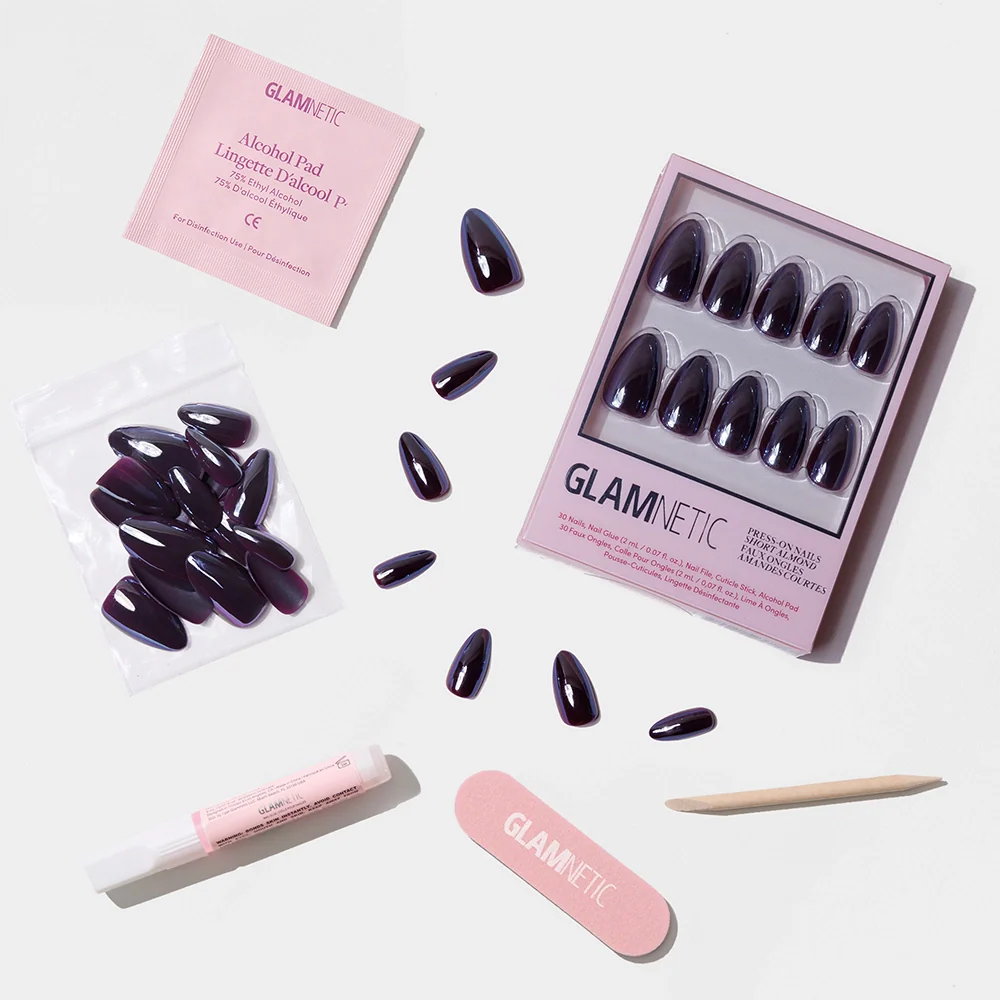 The glamnetic Burgundy Chrome set features reusable press-on nails in a purple shade, a pink nail file, wooden cuticle stick, nail glue, alcohol pad, and extra nails—ideal for fans of short almond chrome styles.