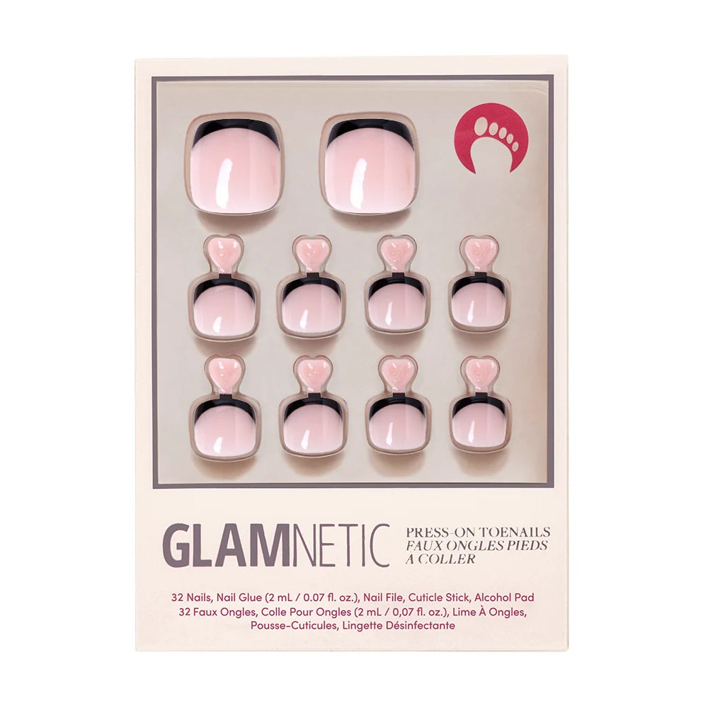 A box of Glamnetic press-on toenails in a nude pink shade with sleek black French tips.