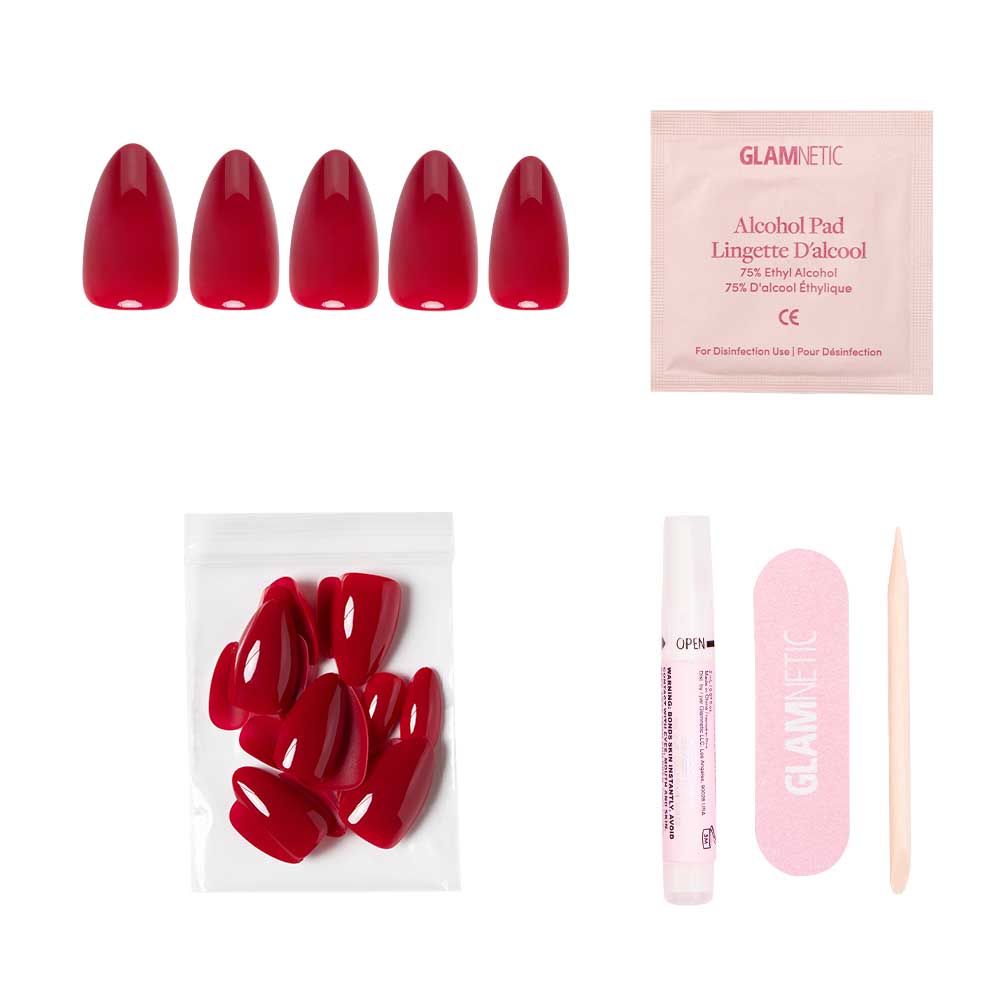The glamnetic Classic Red nail set includes five glossy, almond-shaped nails, an alcohol pad, extra nails in a plastic bag, nail glue, a pink nail file, and a wooden cuticle stick—all displayed on a white background.