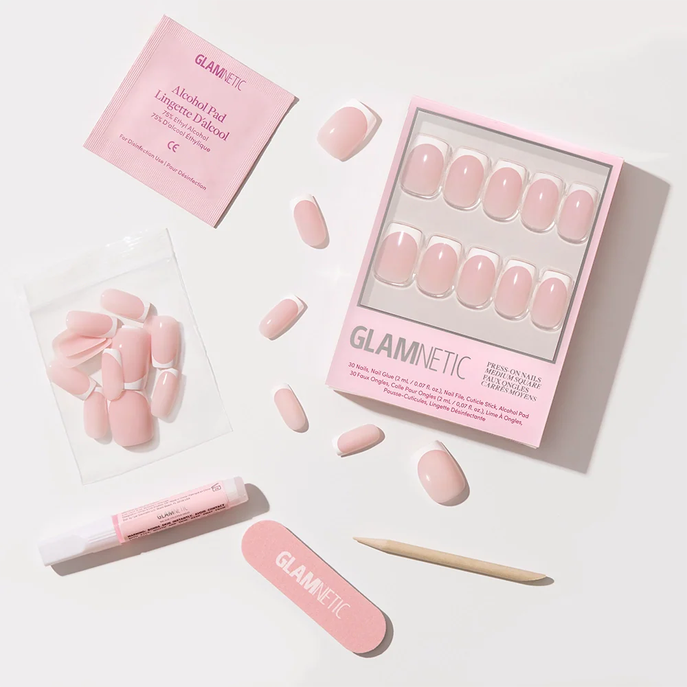 Classy French by glamnetic: pink press-on nails with chic French tips, plus alcohol pad, nail glue, cuticle stick, nail file, and extra nails—everything for a trendy mani with a modern touch.