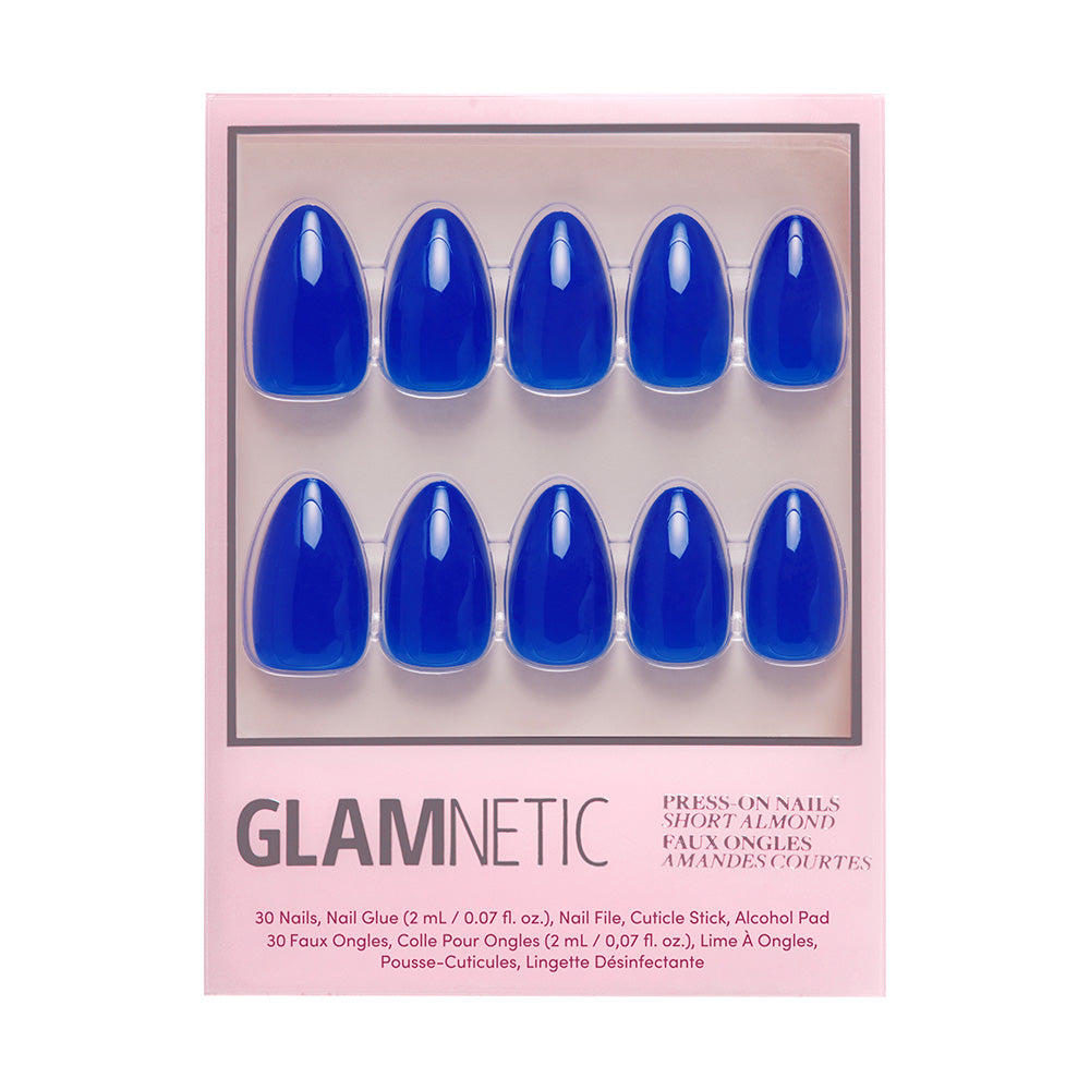 Glamnetic Cobalt Blue press-on nails in a short almond shape come in a pink box, featuring glossy, vibrant blue nails—perfect for your next summer adventure.