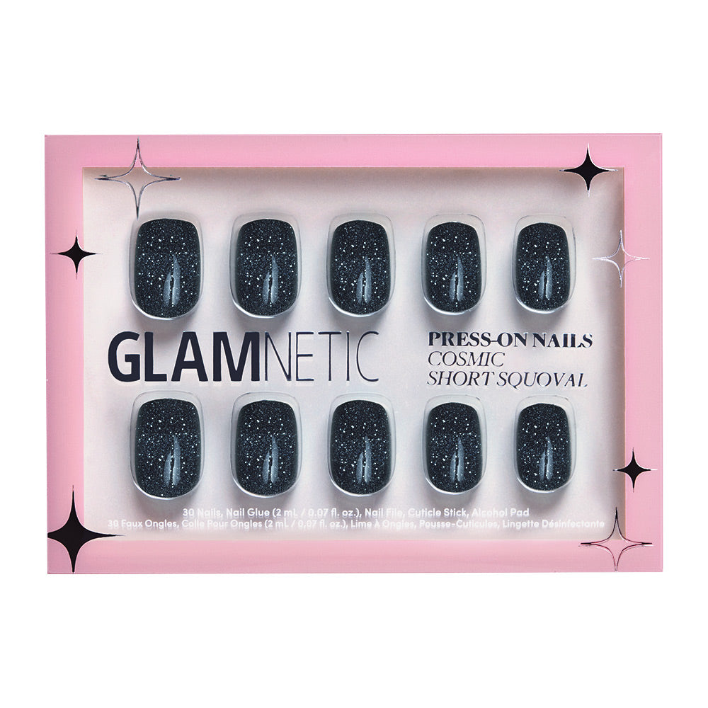 The glamnetic Cosmic set offers short squoval nails in a glossy, semi-transparent black with silver glitter, packaged in pink and white with star accents.