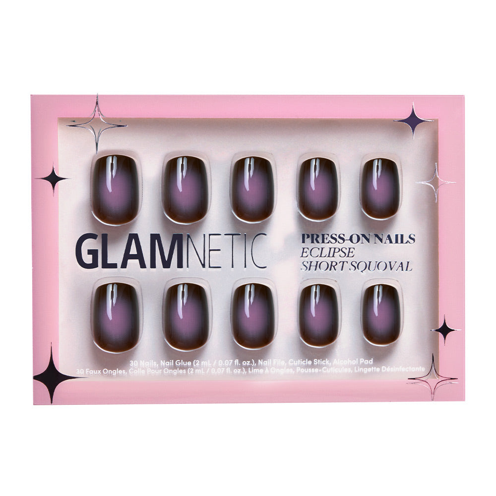 A box of glamnetic Eclipse press-on nails in a short squoval shape with a black and purple gradient design, packaged in vibrant pink.